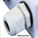 Close-up of AIMS Power solar cable gland showing ribbed white waterproof seal, black gasket, and cable entry port for weatherproof photovoltaic wiring installation.