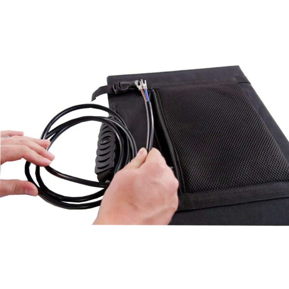 Close-up of AIMS Power foldable solar panel cable storage pocket showing hands handling attached black power leads and connectors.