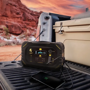 Lion Energy Summit 530W portable power station charging phone outdoors