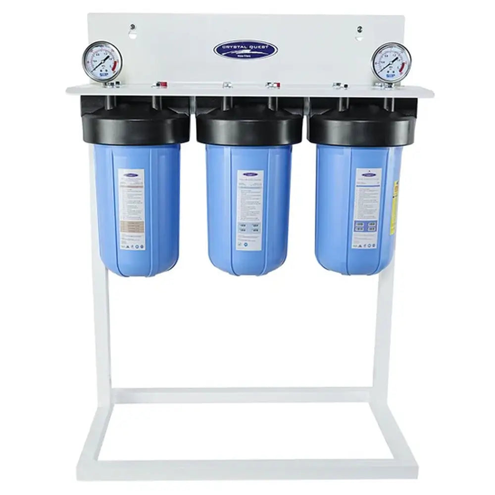Triple stage Crystal Quest SMART Compact whole house filtration system on a white floor stand with dual gauges for easy pressure monitoring.